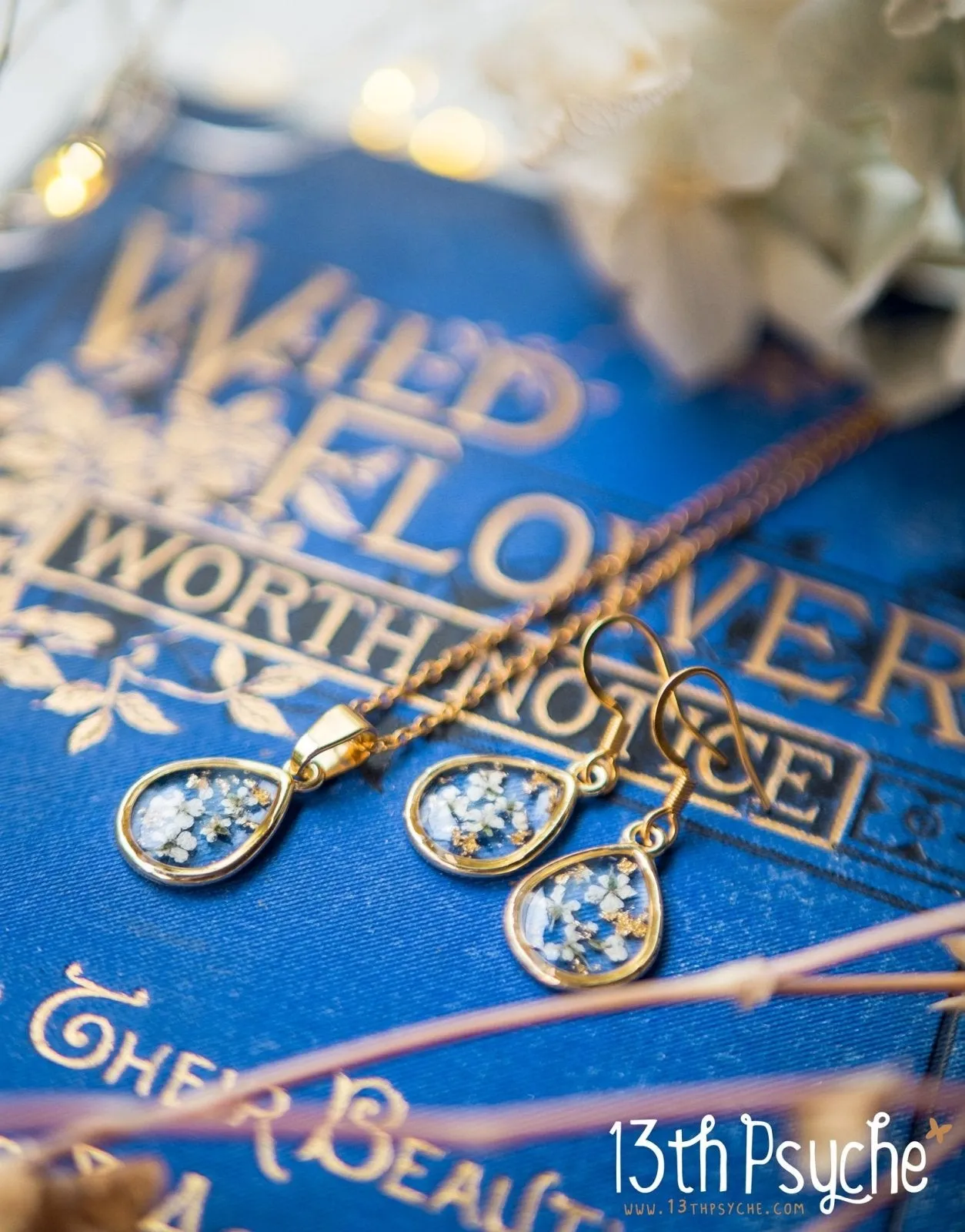 Dried white flowers and gold flakes resin teardrop earrings