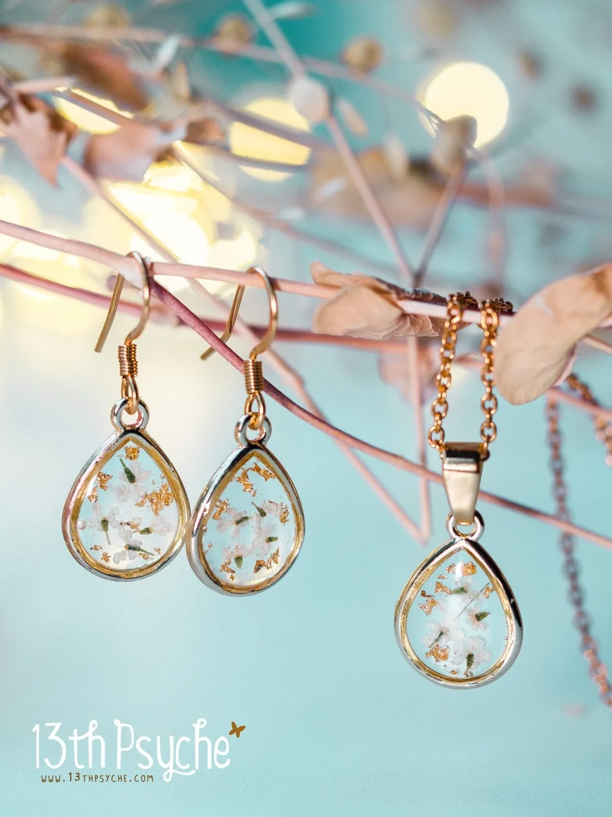 Dried white flowers and gold flakes resin teardrop earrings